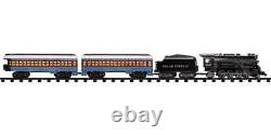 Lionel prêt à jouer au Polar Express avec le modèle à piles de la cloche du Père Noël